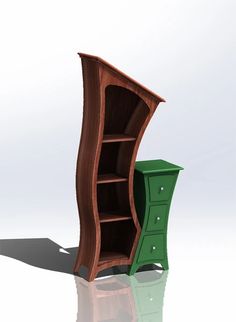 an open bookcase sitting on top of a table next to a green cabinet with drawers