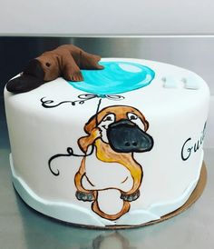 there is a cake with a dog on it