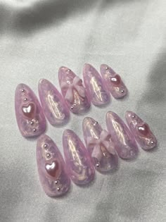 Hi there 🤍 All my press on nail sets are Durable & Reusable  Each nail has a layer  builder applied to it to make the nail nice and strong!   Sizing: Refer to my sizing chart and measurement instructions to guarantee your set fits perfect!  About this Set: Pink pearl design, pink bows, pink pearls, & pink heart charms.  Available Shapes: Short Almond, Long Almond, Long Square, Medium Square, Short Square, Medium Coffin, Long Coffin, &  Long Stiletto.  Along with your nail purchase you will receive a kit that includes -Nail Glue -Nail File -Nail Buffer -Alcohol Wipe - Cuticle Oil  -Cuticle Pusher Nails With Small Pearls, Pearl Design Nails, Nails With Beads, Purple Coquette Nails, Pink And Silver Nail Designs, Nails With Bows And Pearls, Bow Charm Nails, Pink Nails With Charms, Nail Designs With Bow Charms