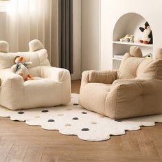 a child's room with two chairs and a teddy bear on the rug in it