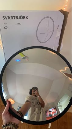 a person taking a selfie in front of a mirror