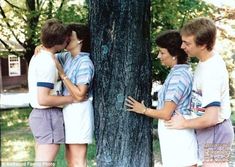 three young men standing next to each other in front of a tree with the caption creepy picture of creeper couple cringeing themselves