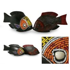 three different types of fish made out of beads