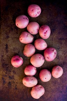 a bunch of potatoes sitting on top of a table