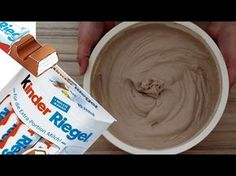 a person is dipping some kind of chocolate into a bowl