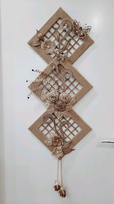 an intricately designed wall hanging on the side of a door