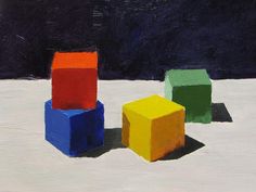 three brightly colored blocks sitting in the snow