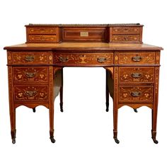 an antique wooden desk with drawers on it