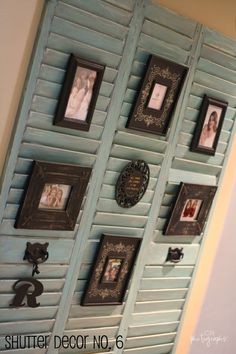 the wall is decorated with many pictures and framed photos, including frames on shutters