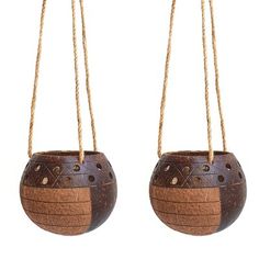 two hanging baskets made out of wood and rope with holes in the middle one is brown