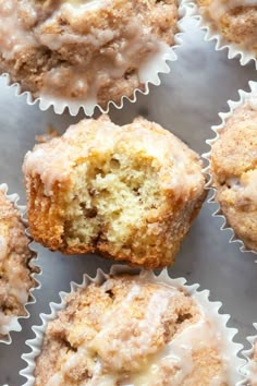 several muffins with icing on top of each other