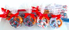 some pretzels wrapped in red, white and blue sprinkles are sitting on a table