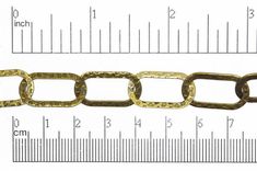 an image of a chain that has been cut in half and is being measured by a ruler