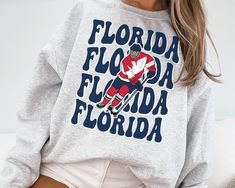 WELCOME TO MY STORE ♥️ This Florida Panther Sweatshirt, Vintage Florida Panther Sweatshirt \ T-Shirt, Panthers Sweater, Panthers T-Shirt, Hockey Fan Shirt, Retro Florida Ice Hockey. Please check Color and Size Charts before placing the order. You can find them in the listing's photos (Depending on what device you are viewing this listing colors may vary slightly). Returns and exchanges are accepted only if there are defects "No Extra Costs" _UNISEX T-SHIRT * 100% cotton for solid colors * Heathe Florida Panthers Hockey Game Outfit, Retro Florida, Florida Panthers Hockey, Panthers Svg, Vintage Nashville, Hockey Sweater, Florida Panther, Softball Mom Svg, Hockey Fans