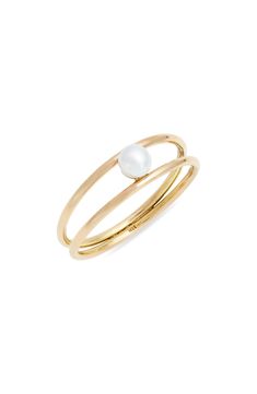 A delicate cultured pearl appears to float between two handmade 14-karat-gold bands, creating a whimsical touch that will charm any ring stack. 1/4" width Pearl size: 4mm 14k gold/cultured pearl Made in Canada Asian Owned/Founded Gold Stackable Pearl Ring In 14k Gold, Double Band Ring, White Pearl Ring, Cultured Pearl Ring, Push Presents, Knot Tying, Cute Ring, Double Band Rings, Gold Pearl Ring