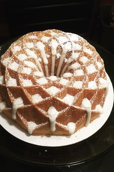 a waffle cake with icing on a plate