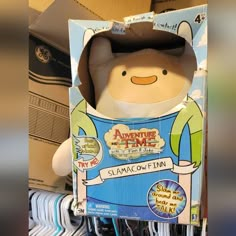 an adventure time stuffed animal in a box