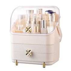 a white box with many different types of cosmetics in it's lid and handles