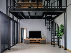 a living room filled with furniture and a flat screen tv