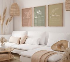 a living room filled with white furniture and lots of pillows on top of the couch