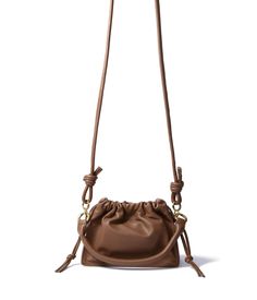 The Riley bag, a very simple, trendy, and practical crossbody bag.??Crafted with??smooth genuine leather, this bag gives a very youthful vibe so make sure to take this bag to your next concert or your next music festival!??Genuine leatherGold finish hardware 7.9" x 5.9" x 3.2" (20cm x 15cm x 8cm)Drawstring top closureAdjustable leather shoulder strapImported Material: Leather Top Designer Bags, Chanel Clutch, Investment Bags, Drawstring Top, Purse Styles, Casual Dinner Outfit, Chic Boutique, Body Style, Pouch Bag