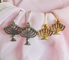 This are beautiful  Menorah Earrings. The silver charm is about an inch long, the antiqued gold charm is slightly smaller. There is amazing detail throughout.  The earrings can come in either Silver plated or sterling silver lever backs, or silver plated French Hooks, and the gold comes with either goldtone lever backs or French Hooks.  These are beautiful and would make an excellent gift for Hanukkah. Menorah, Gold Set, Gold Charm, Silver Charms, Hanukkah, Antique Gold, Silver Gold, Gold Tones, Jewelry Earrings Dangle