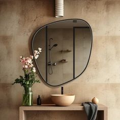 a bathroom with a sink, mirror and vase