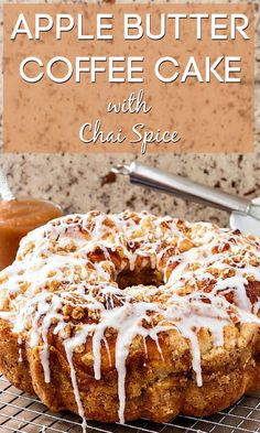 an apple butter coffee cake on a cooling rack with icing drizzled