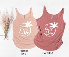 two tank tops with palm trees and the words girls on fire written in white ink