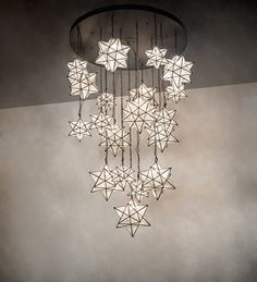 a chandelier with stars hanging from it