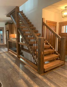 a wooden staircase in a home with hardwood floors