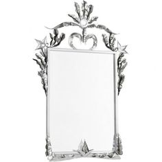 a mirror with an ornate design on the front and back sides, hanging from a wall