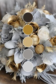 a bridal bouquet with gold, silver and white flowers