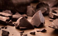 several pieces of chocolate sitting on top of a table