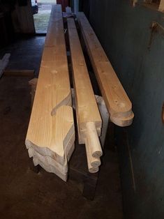 two wooden benches sitting next to each other