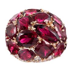 Warm hues of magenta rubellite are peppered with brilliant white diamonds atop a polished mounting of 18 karat rose gold. The ring boasts playfulness and mid-century-inspired character in addition to its 20 carats of tourmaline and .70 carats of diamonds. Generous in both style and substance, this bit of fine fashion jewelry can be enjoyed with both formal and informal attire. Compliment will ensue. Size 6.5 can be resized on request. Rubellite Ring, Informal Attire, Month Gemstones, Ruby Jewel, Color Stones, Cluster Rings, Dome Ring, How To Make Rings, Fancy Diamonds