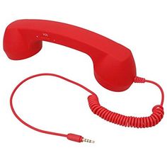 an old red telephone with cord attached to it