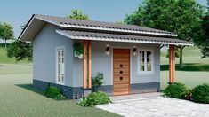 a small gray house with a wooden door and windows on the front porch is surrounded by greenery