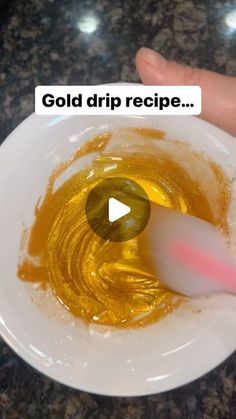 a person is holding a spoon in a bowl with oil on it and the words, gold drip recipe