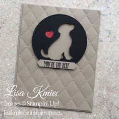 a card with the silhouette of a dog holding a heart