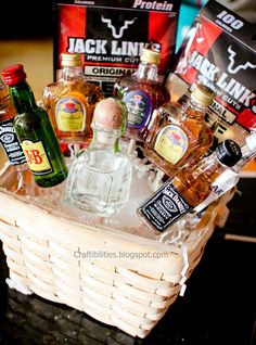 a basket filled with liquor bottles on top of a table