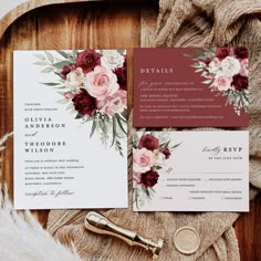 wedding stationery with burgundy and white flowers