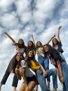 a group of young women standing next to each other