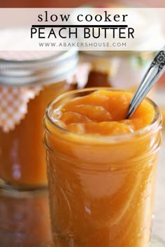 a jar filled with peach butter sitting on top of a table