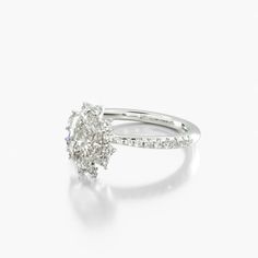 an oval diamond ring on a white background