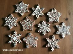 snowflake cookies are arranged on a table