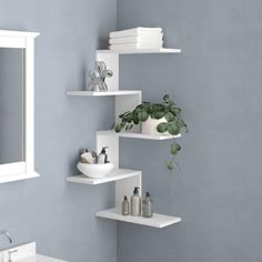 a bathroom with blue walls and white shelves