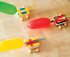 small toy cars are lined up on the floor