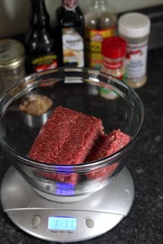 a glass bowl filled with food on top of a scale