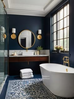 a bath room with a tub a sink and a mirror on the wall next to a window